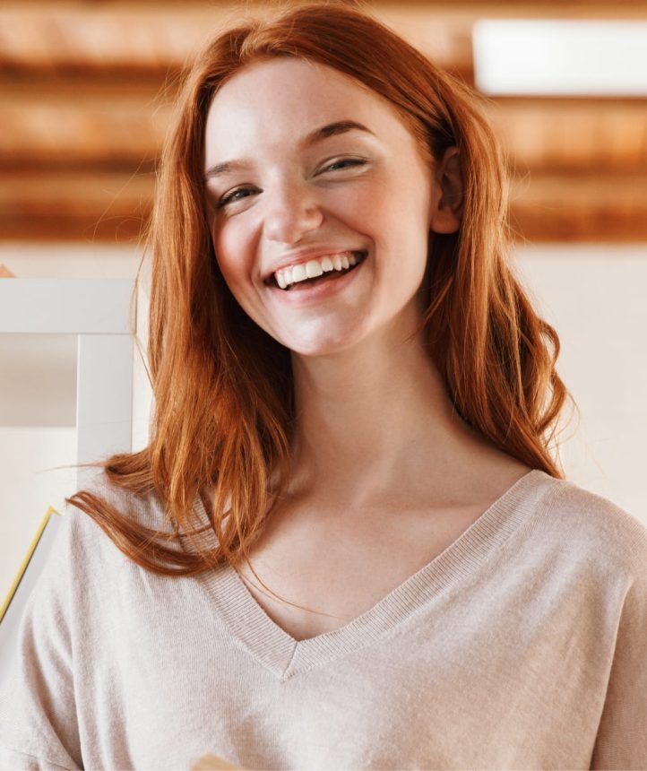 2-happy-redhead-young-lady-student-reading-book-look-M5Z7RVC.jpg